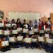 Mahasiswa KKN-T 114 Unhas bersama siswa dan guru usai penyerahan sertifikat dan piala lomba literasi (Sumber: Dokumentasi KKN-T 114 Unhas)