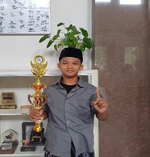 Siswa Kelas 8E, Mohamad Danish Saputra, Raih Juara I Lomba Kaligrafi 46 WhatsApp Image 2026 02 13 at 15.47.07