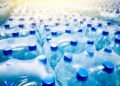 Lonjakan Harga Plastik Dampak Konflik Timur Tengah: Ujian bagi Dunia Industri dan UMKM Indonesia 49 Many packaged blue mineral water bottles in stock in a store or market.