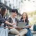 Hubungan Penggunaan Media Sosial Dengan Kebiasaan Prokrastinasi Akademik Mahasiswa 53 Beautiful young Asian woman college student with friends at outdoors. College student working on the college campus