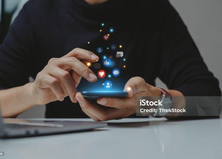 Hand of young business using smartphone, Social media concept