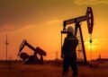 Beban Berat Subsidi Energi di Tengah Volatilitas Minyak Dunia: Pengujian Resiliensi APBN 2026 48 073947200 1687477196 worker oil rig sunset created with generative ai technology